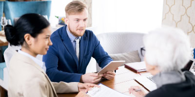 insurance-agents-with-senior-woman