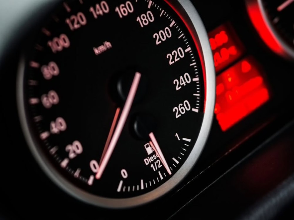 Image of a high-mileage driver on the highway near Tempe with text overlay: "Protect your car and wallet with custom auto insurance. Contact Premier Choice Insurance for personalized coverage today."