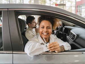 A young driver reviewing auto insurance coverage options—get help choosing the right plan from Premier Choice Insurance.