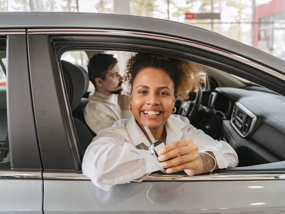 A young driver reviewing auto insurance coverage options—get help choosing the right plan from Premier Choice Insurance.