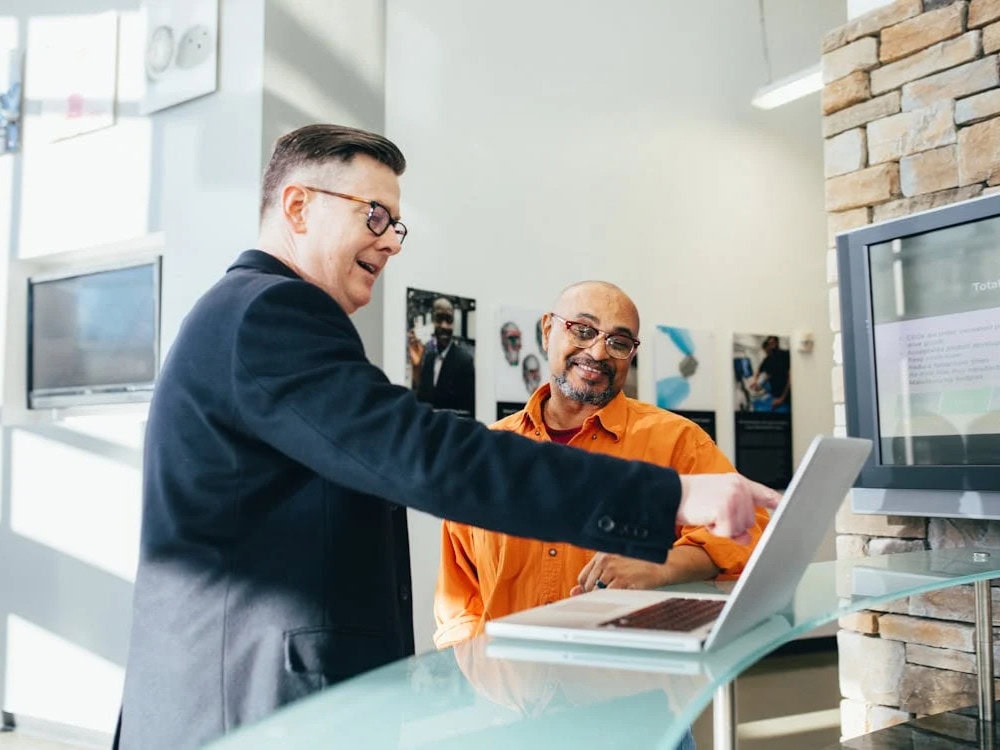 Local Gilbert business owner reviewing their policy with an agent. Discover how a Business Owner’s Policy can protect your small business—contact us today for expert help.